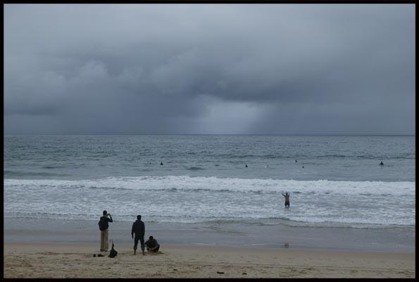 people still enjoy time out at Manly beach, even though it's cold 