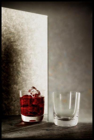 Still Life with empty glass and a red drink