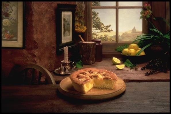 Still Life with a lemon pie and lemons, in a French rustic setting